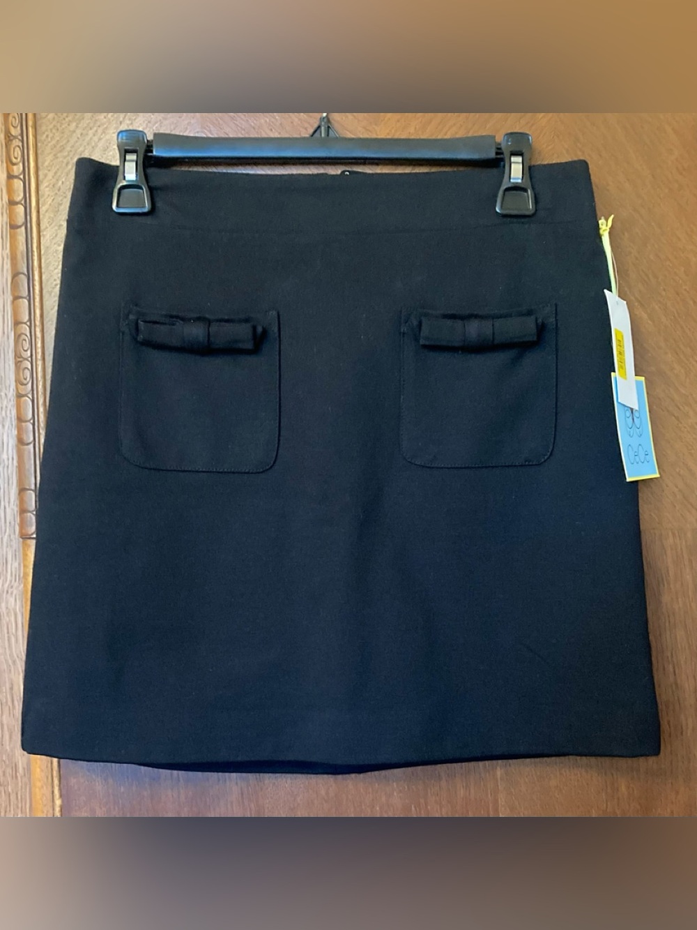 NWT CeCe Spring Calling bow pocket miniskirt in black - sz 6